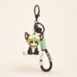 Devon Cat keychain featuring black and white cat figurine wearing aviator goggles and helmet with bell