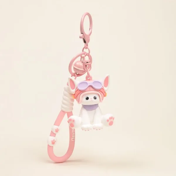 Cute white cat keychain with pink aviator helmet, goggles, bell, and paw print strap