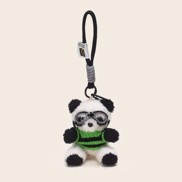 Plush panda keychain wearing green striped sweater and aviator goggles with black loop strap