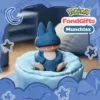 Munchlax Pokemon figure sitting in blue pet bed, FondGifts collectible with moon and star decorations