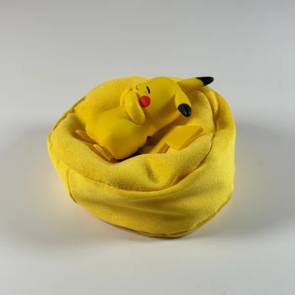 Pokémon Pikachu Ornament (4) Sleeping Pikachu figure resting in a yellow fabric bean bag cushion