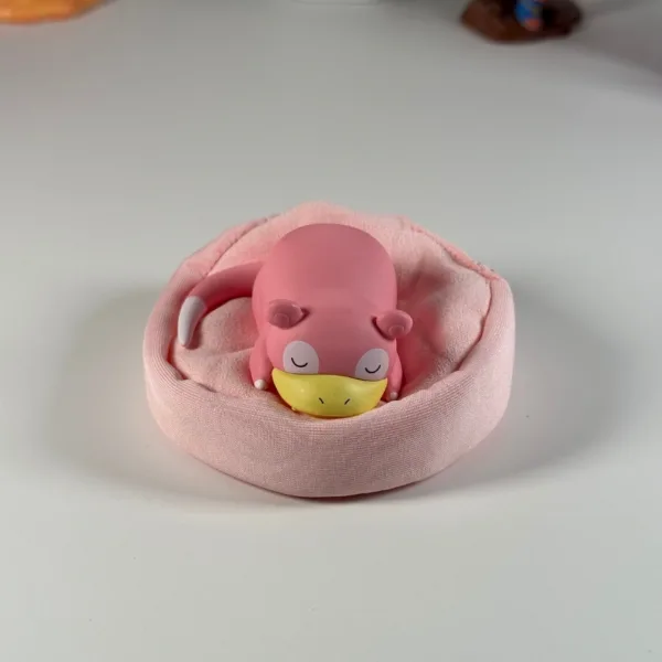 Pokémon Slowpoke Ornament (1) Sleeping pink Slowpoke Pokemon figure resting in soft pink plush bed