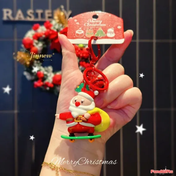 Santa Claus Skateboard Keychain Christmas Holiday Gift Charm Santa Claus skateboarding keychain with Merry Christmas tag held in hand