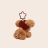 Brown teddy bear keychain with red beanie hat and star-shaped clip