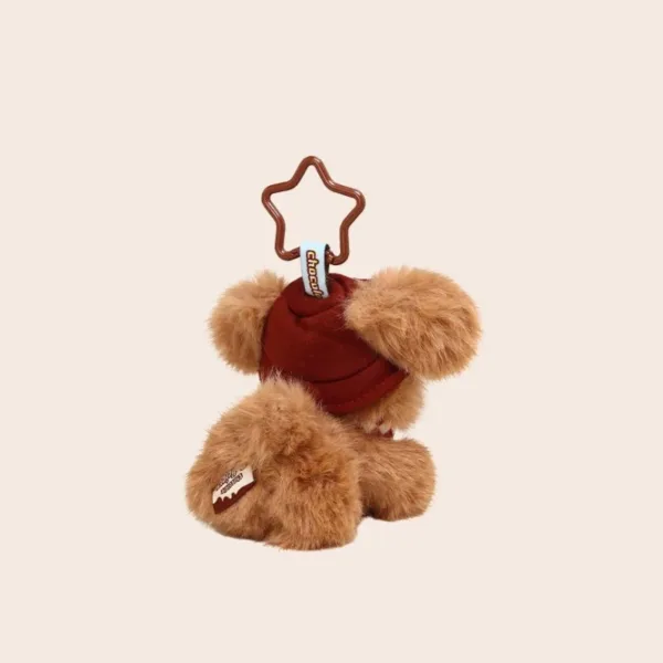 Brown teddy bear keychain with red beanie hat and star-shaped clip