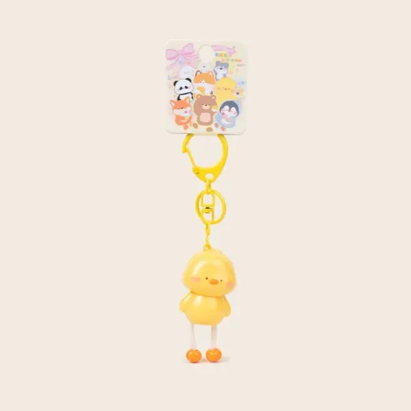 Cute yellow chick keychain with dangling legs and orange feet on colorful animal backing card