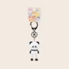 Cute panda character keychain with pink cheeks and black carabiner clip on retail card