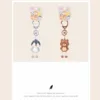 Cute penguin and bear character keychains with colorful animal display cards