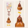 Brown chicken keychain charm with yellow feet and red comb on cute animal backing card