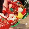 Santa Claus Skiing Keychain Christmas Holiday Accessory Santa Claus skiing keychain with red bells and Christmas tree charm held in hand