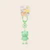 Cute green frog keychain with dangling legs and kawaii animal character backing card
