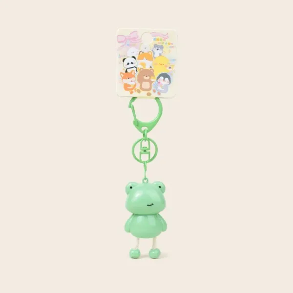 Cute green frog keychain with dangling legs and kawaii animal character backing card