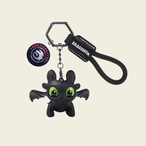 Black Toothless dragon keychain with green eyes and DragonsFest branding