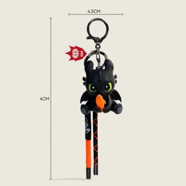 Toothless dragon keychain figurine holding orange fish, 4.5cm x 4cm with braided strap