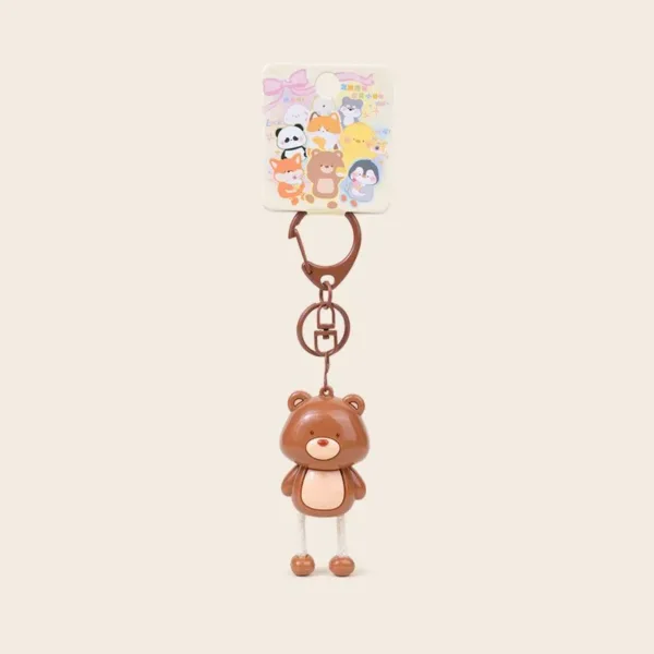 Cute brown bear keychain with dangling rope legs and colorful animal character backing card