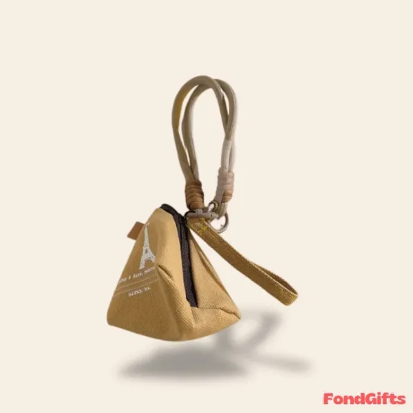 Small tan canvas pyramid coin purse with Eiffel Tower print and wrist strap