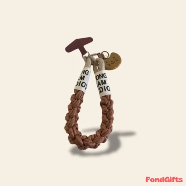 Braided brown leather keychain strap with LONG AM DIOS text labels and smiley face charm