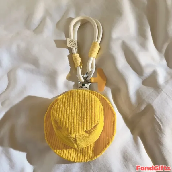 Yellow Corduroy Bucket Hat Keychain Charm with Rope Strap Yellow corduroy bucket hat keychain with white rope strap and CRYLER brand tag on white fabric background