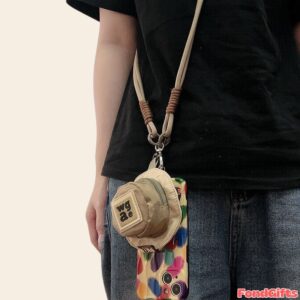 Crossbody phone case with colorful pattern, mini wgae pouch, and beige lanyard strap