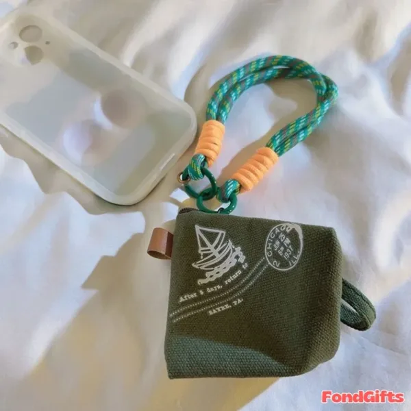 Olive green canvas coin pouch with Chicago postmark design and braided phone strap