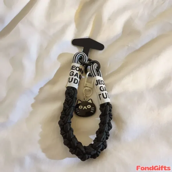 Black braided phone lanyard with cat charm and JEON GA TU text labels