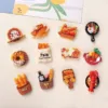 Food-themed refrigerator magnets featuring bread, pastries, pizza, and cooking pans