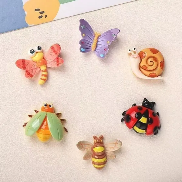 Six colorful resin garden creature magnets featuring dragonfly, butterfly, snail, beetle, ladybug, and bee