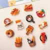 Colorful food-themed refrigerator magnets featuring bread, pizza, pastries, and seafood dishes