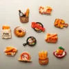 Food-themed refrigerator magnets featuring bread, pastries, pizza, and French cuisine items