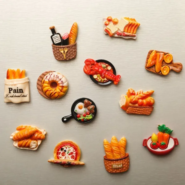 Food-themed refrigerator magnets featuring bread, pastries, pizza, and French cuisine items