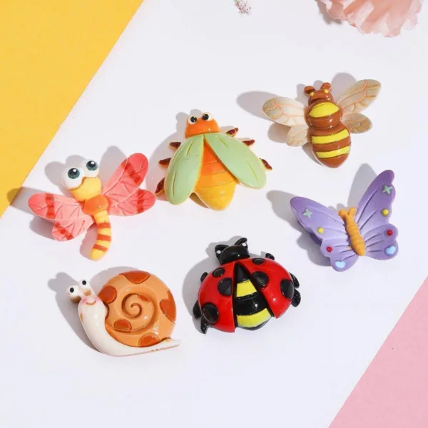 Colorful resin insect charms featuring dragonfly, beetle, bee, snail, ladybug, and butterfly