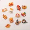 Colorful food-themed refrigerator magnets featuring bread baskets, lobster, donuts, pizza, and vegetables