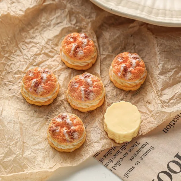 Cream puffs with golden choux pastry tops on crinkled brown paper and newspaper