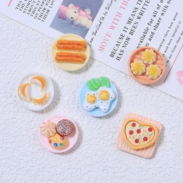 Miniature resin food charms featuring eggs, pizza, dumplings, cookies, and churros on tiny plates