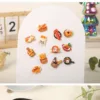 Food-themed refrigerator magnets featuring bread baskets, pastries, and breakfast items on white display board