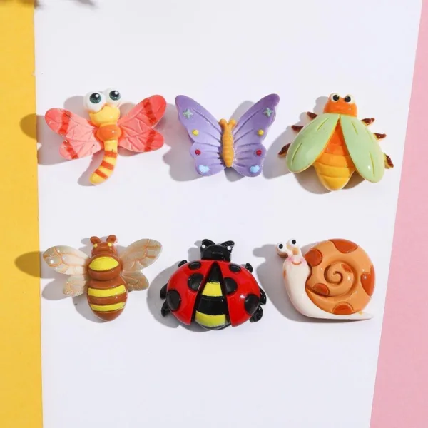 Six colorful resin bug charms featuring dragonfly, butterfly, beetle, bee, ladybug, and snail